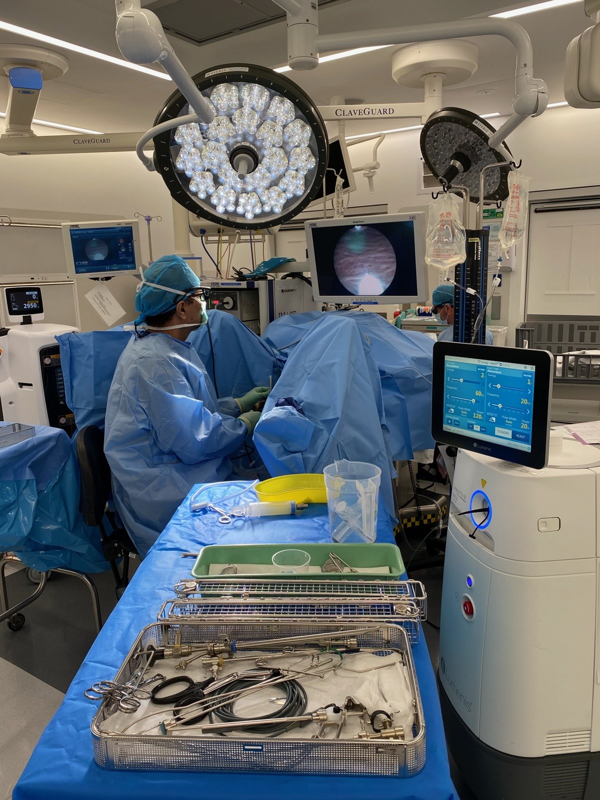 Operating theatre view showing holmium laser platform and endoscopic monitor