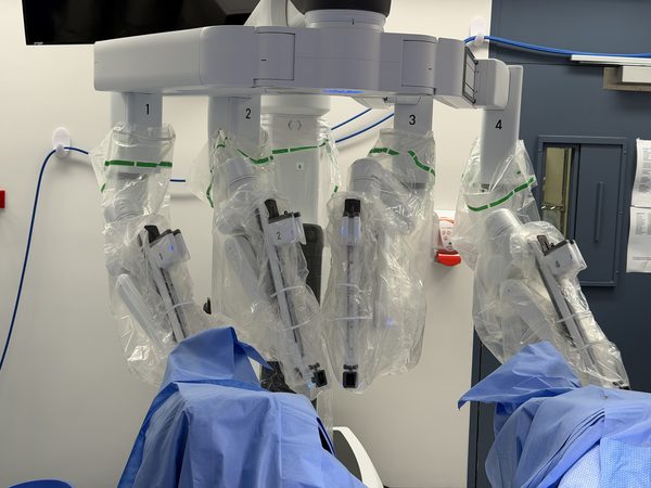 Multiport robotic arms positioned for surgery