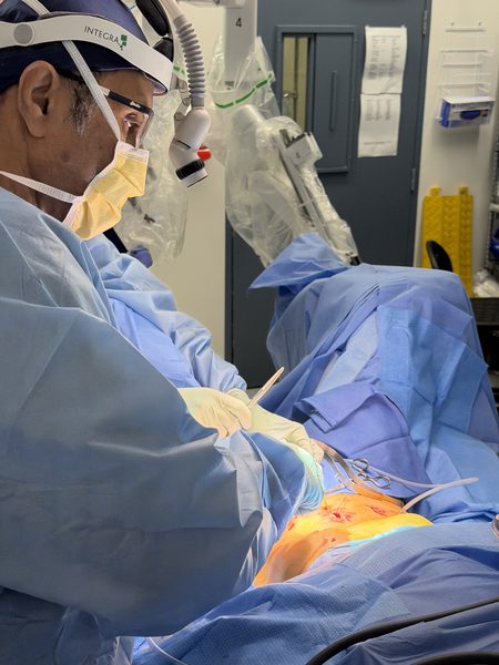 Theatre team with robotic surgery equipment