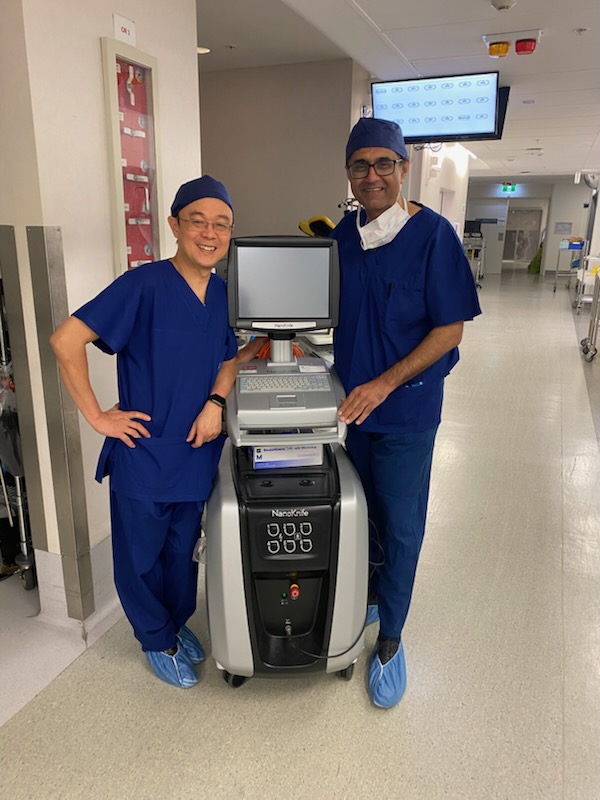 Dr Raji Kooner with a colleague beside a NanoKnife pulse generator